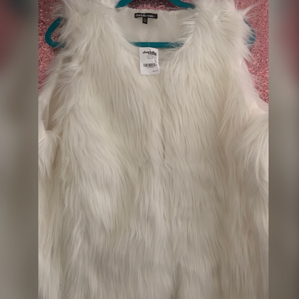 White fur vest